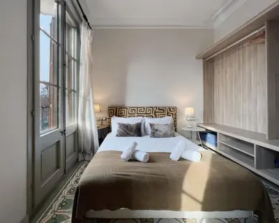 a bedroom with a large bed with two pillows at Stay U-nique Apartments Borbó II in Barcelona