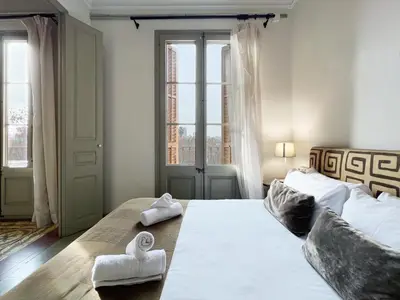 a bedroom with two beds with towels on them at Stay U-nique Apartments Borbó II in Barcelona