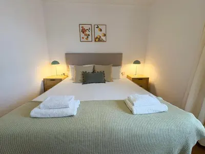 a bedroom with a bed with two towels on it at Stay U-nique Apartments Borbó in Barcelona