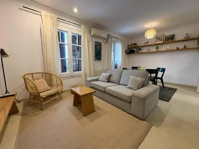 a living room with a couch and a chair at Stay U-nique Apartments Borbó in Barcelona