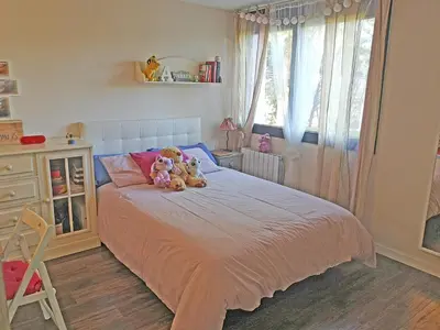 a bedroom with a bed with two teddy bears on it at Premium Habitat La Plana in Argentona