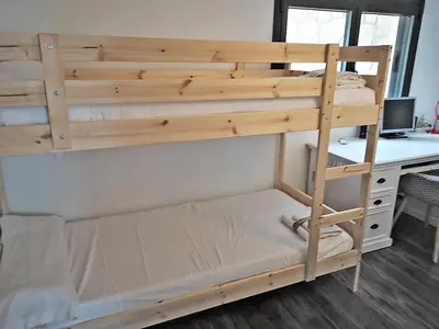a bunk bed in a room with a desk at Premium Habitat La Plana in Argentona