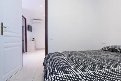a bedroom with a black and white checkered bed at Flat Barcelona in Barcelona