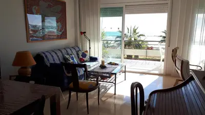 a living room with a couch and a table at Casa Ana -Cubelles in Cubelles