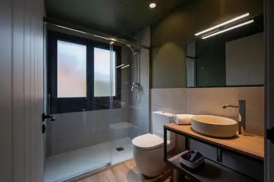 a bathroom with a sink and a toilet and a shower at Apartaments Agulles de Montserrat in Monistrol