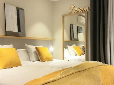 a bedroom with two beds and a large mirror at Sitges Spaces Sea View Paradise- 2 Bedrooms, 2 Bathrooms, Terrace, Amazing Sea Views in Sitges