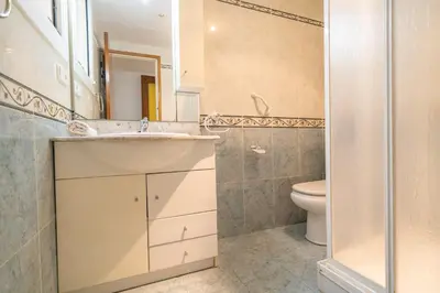 a bathroom with a sink and a toilet at HomeHolidaysRentals Destan - Costa Barcelona in Pineda de Mar