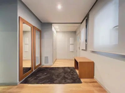 a room with a hallway with a door and a rug at Stay U-nique Apartments Rambla Catalunya II in Barcelona