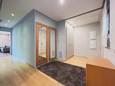 a living room with blue walls and a mirror at Stay U-nique Apartments Rambla Catalunya II in Barcelona