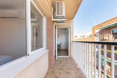 a balcony of a building with a window and a heater at Cadillac Check-in flexible-Bien comunicado-cerca Barcelona in Cornellà de Llobregat