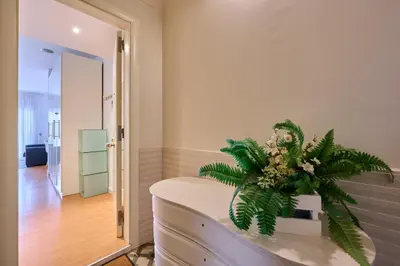 a room with a table with a plant on it at Precioso Loft en Badalona Centro in Badalona