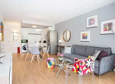 a living room with a couch and a table at SITGES POOL & SEA TERRACE Luxury, comfort, unbeatable location in Sitges