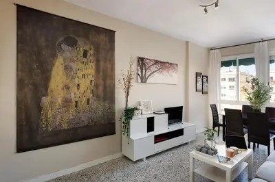 a living room with a large painting on the wall at Mercat Sant Antoni 1 in Barcelona