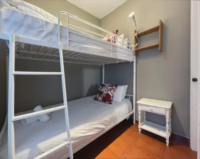 a bedroom with two bunk beds and a desk at Stay U-nique Apartments Rogent in Barcelona