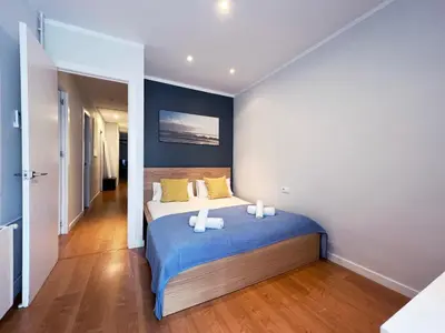 a bedroom with a bed with two pillows on it at Stay U-nique Apartments Travessera in Barcelona