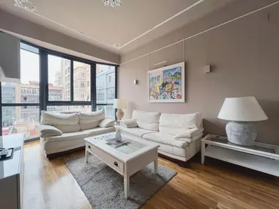 a living room with a couch and a table at Stay U-nique Apartments Urquinaona in Barcelona