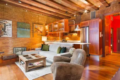 a living room with a couch and a table at Stay U-nique Apartments Urquinaona in Barcelona