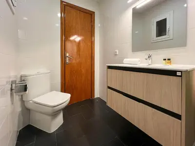 a bathroom with a toilet and a sink at Stay U-nique Apartments Salva II in Barcelona