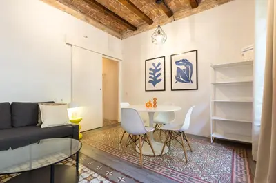 a living room with a table and a couch at Stay Unique Apartments Corsega in Barcelona