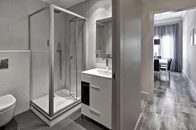 a bathroom with a shower and a sink and a toilet at Habitat Apartments Paseo de Gracia in Barcelona