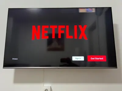 a television screen with the netflix sign on it at New Camp Nou Apartment/Diret Airport,Beautiful in Hospitalet de Llobregat