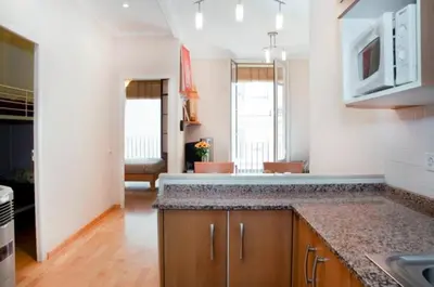 a kitchen with a sink and a counter top at Bbarcelonapartment Acogedor, tranquilo con Balcón in Barcelona