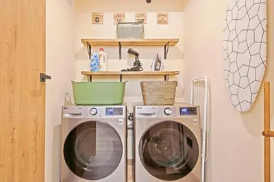 a laundry room with two washer and dryer at Olivia Barcelona in Barcelona