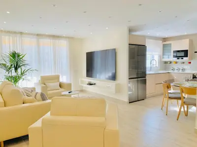 a large living room with a couch and a table at Sitges Spaces Oasis Suites- 4 Bedroom, 4 Ensuite Bathrooms, Terrace, Pool, Sitges Centre in Sitges
