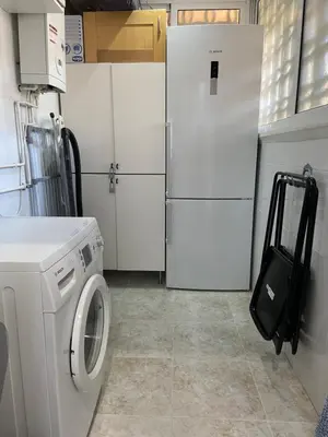 a kitchen with two refrigerators and a washing machine at Karin Palma Fiesta-Vallpineda-Sitges in Sant Pere de Ribes