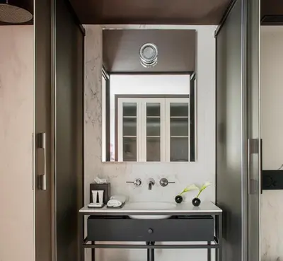 a bathroom with a sink and a mirror at Antiga Casa Buenavista in Barcelona