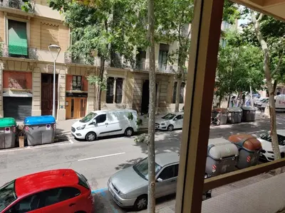 a view from a window of cars parked on a street at Guest House Barcelona Bruc in Barcelona