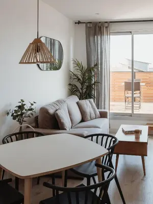 a living room with a couch and a table at Apartamentos Espai Progres by Be Barcelona in Hospitalet de Llobregat