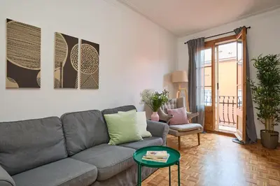 a living room with a couch and a table at Casa Cosi - El Farro 3 in Barcelona