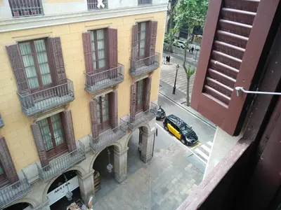 an overhead view of a building with a car parked in front at Colom Apartments in Barcelona