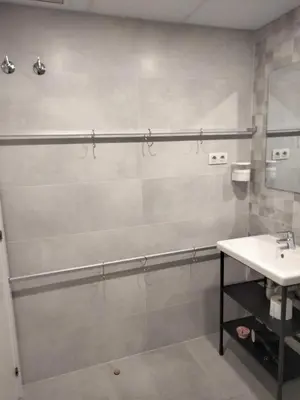 a bathroom with a shower and a sink at Apartamentos Turísticos Tenor by Bossh! Hotels in Barcelona