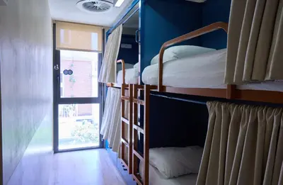 two bunk beds in a room with a window at Latroupe Poblenou Beach in Barcelona