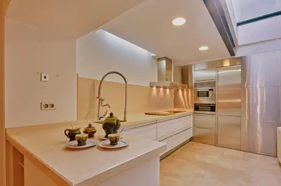 a kitchen with a counter with two mugs on it at Casa de Pueblo junto Barcelona Centro in Vilassar de Dalt