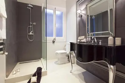 a bathroom with a shower and a sink and a toilet at Apartments Barcelona & Home Deco Centro in Barcelona