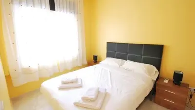 a bedroom with a bed with two towels on it at Homenfun Barcelona Paralelo in Barcelona
