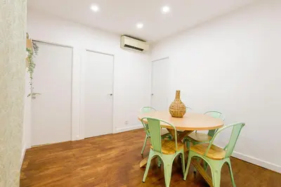 a dining room with a table and chairs at Alcam Torrent in Barcelona