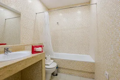 a bathroom with a sink and a toilet and a bath tub at Alcam Torrent in Barcelona