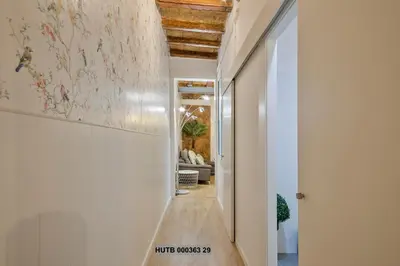 a hallway with white walls and a ceiling at Alcam Gignas in Barcelona