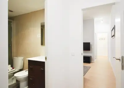 a bathroom with a toilet and a sink at Alcam Valencia II in Barcelona