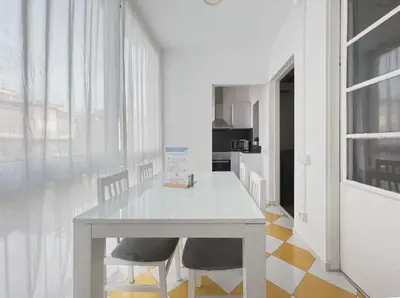 a kitchen with a white table and two chairs at Stay U-nique Apartments Vila de Gracia in Barcelona