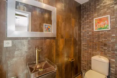 a bathroom with a toilet and a mirror at Sitges Spaces Sea View Villa- 6 Bedrooms, 5 bathrooms, 2 private pools, Near center in Sitges