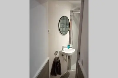 a bathroom with a sink and a mirror at M2 Cool apartment next to metro. 15m to center in Esplugues de Llobregat