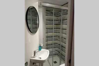 a bathroom with a sink and a mirror at M2 Cool apartment next to metro. 15m to center in Esplugues de Llobregat