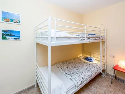 a bedroom with two bunk beds in a room at Apartment Camp Nou by Interhome in Barcelona