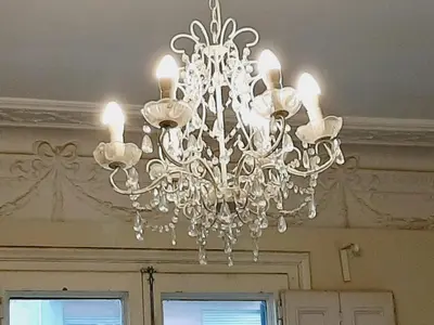 a chandelier hanging from a ceiling in a room at Lumine Luxury Suites by gaiarooms in Barcelona