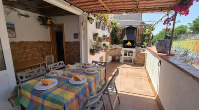 a table with plates of food on top of a house at Attic, Walk to Park Güell, Sagrada Familia, Metro nearby in Barcelona